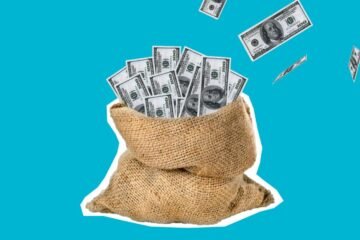 Burlap sack filled with hundred dollar bills against a clean blue background, symbolizing wealth and savings.